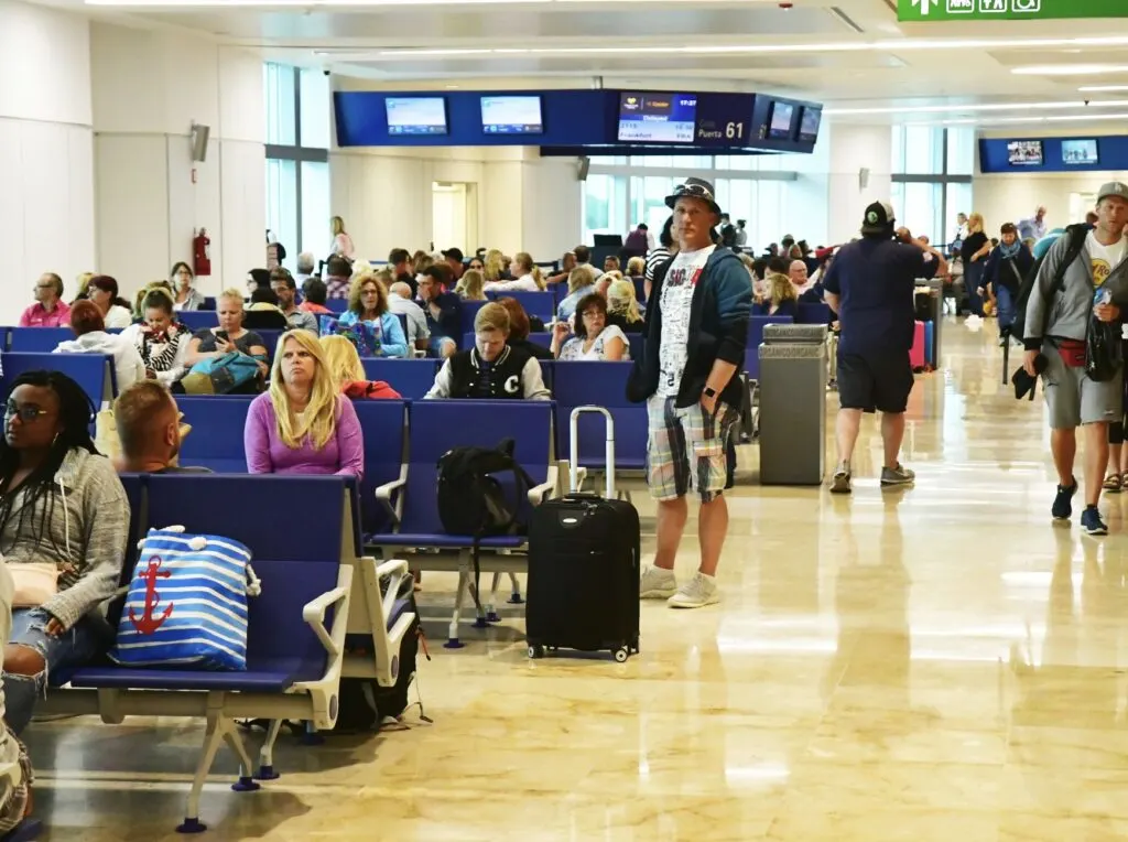 Travelers Wait For Departure Busy Cancun Airport