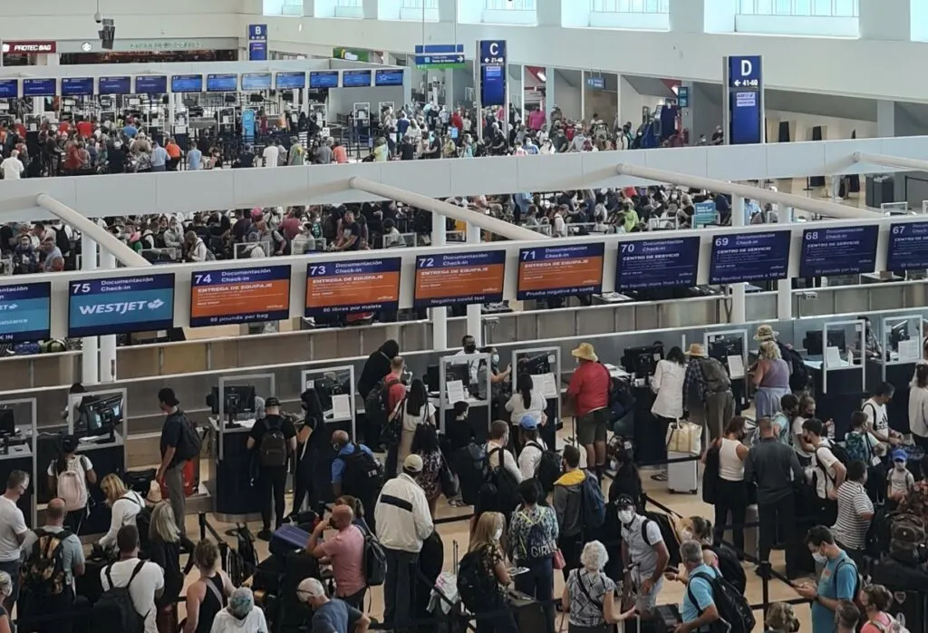 Cancun travelers checking in for flights