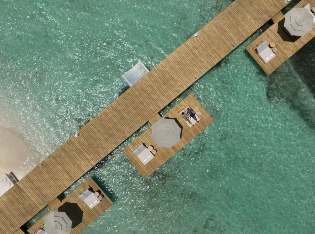 Couple on Honeymoon on dock and private umbrella