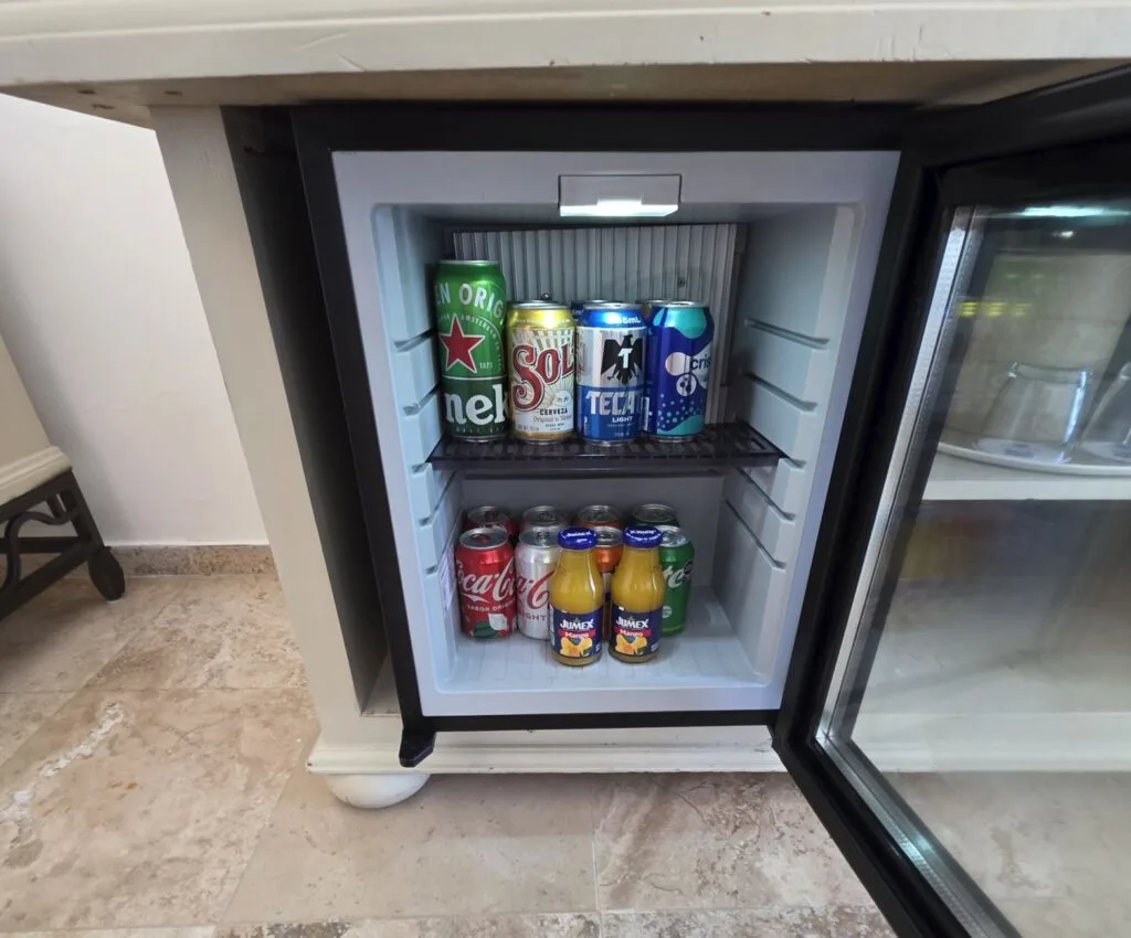 Mini Bar fridge at Cancun  Sandos Resort fullly stocke. Original Photo By Trevor Kucheran