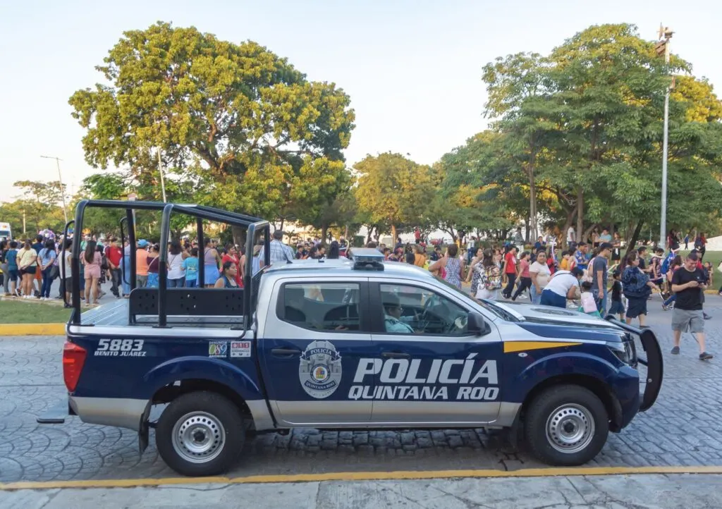 Police on busy street and park in Cancun