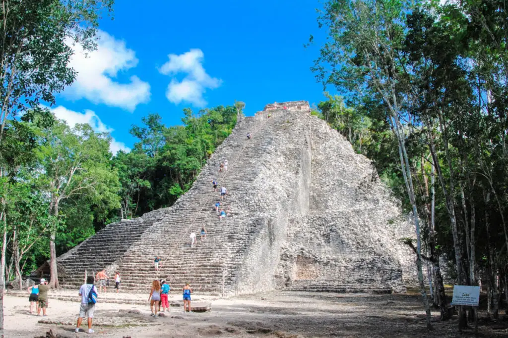 Coba ruins with tourists climbing