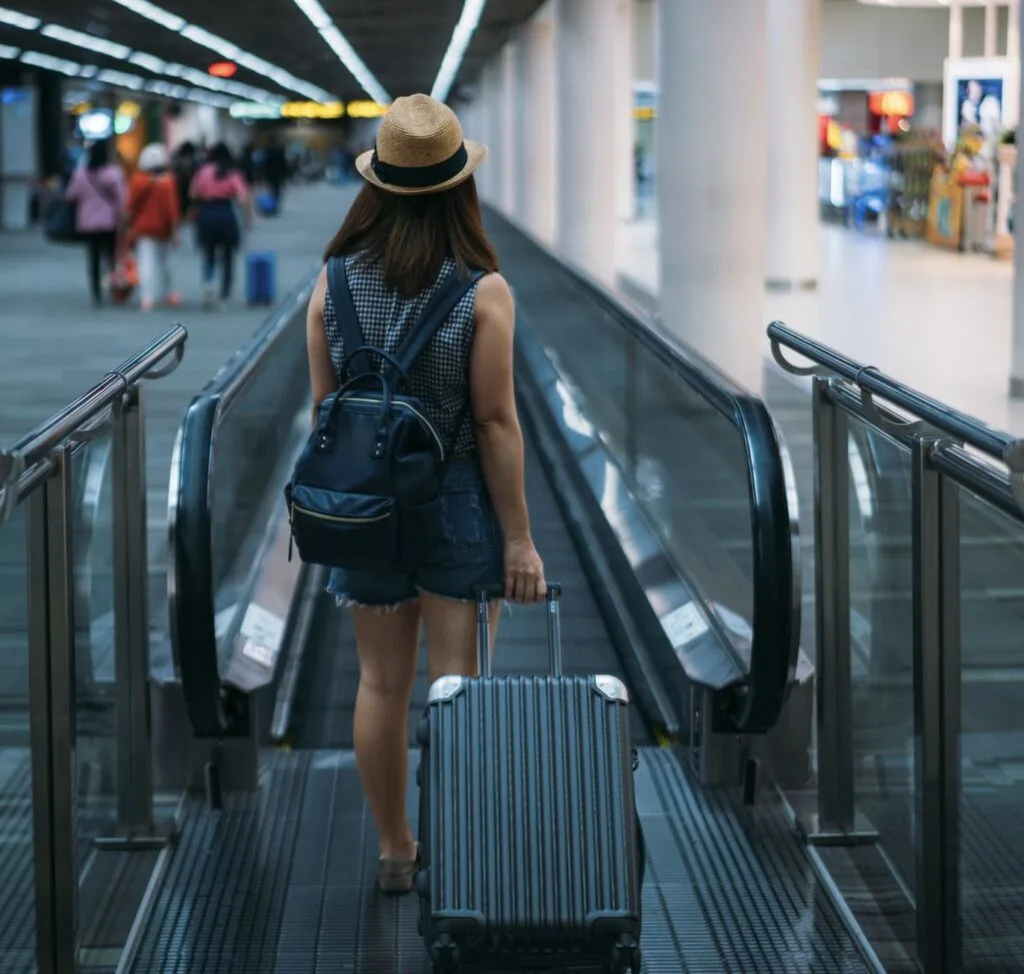 Traveler With Carry On Luggage