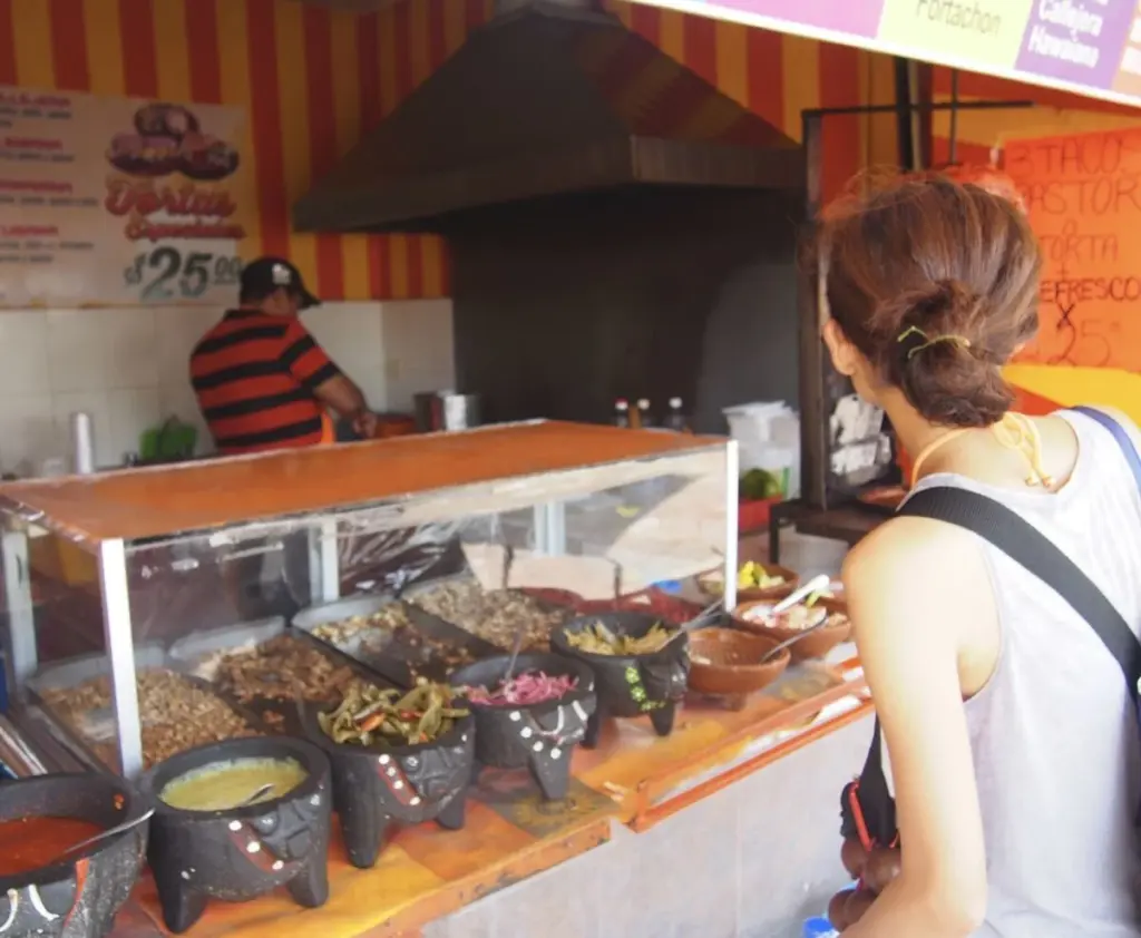 Traveler at traditonal taco stand