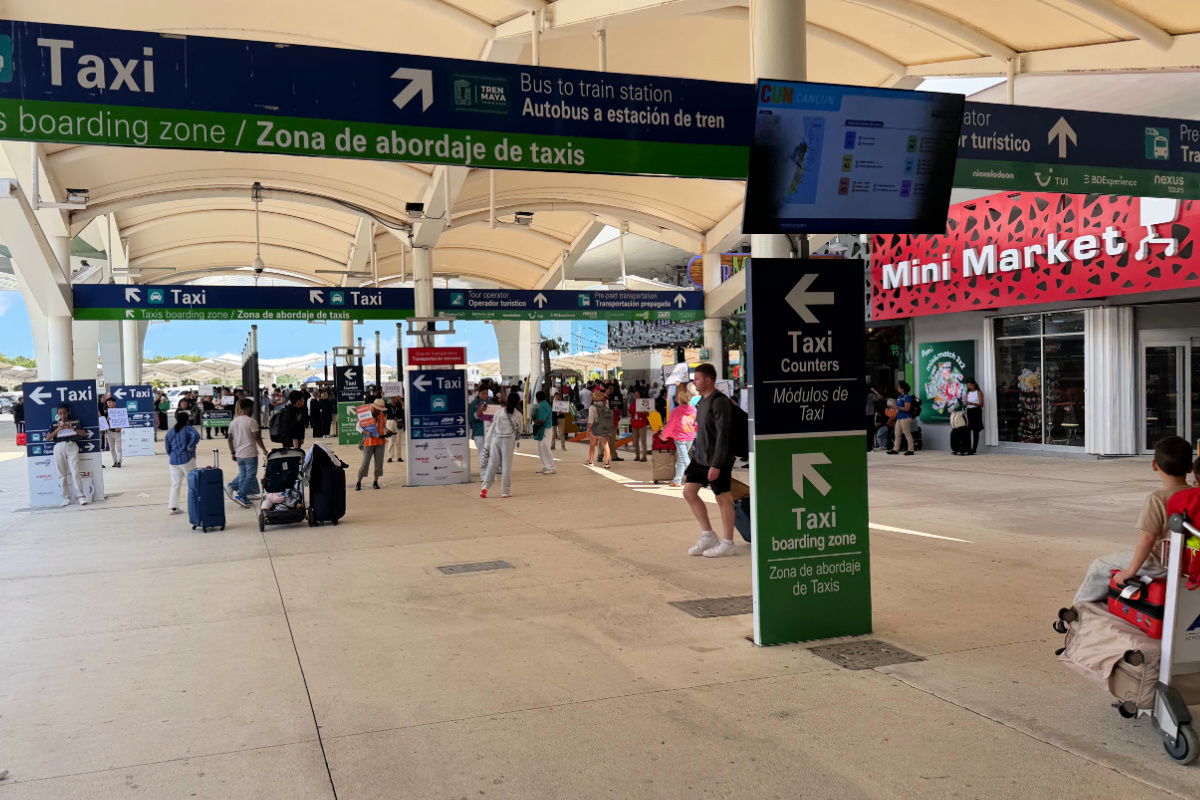 Cancun Airport exit with taxis ready