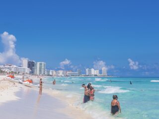 Cancun swimming beach with tourists