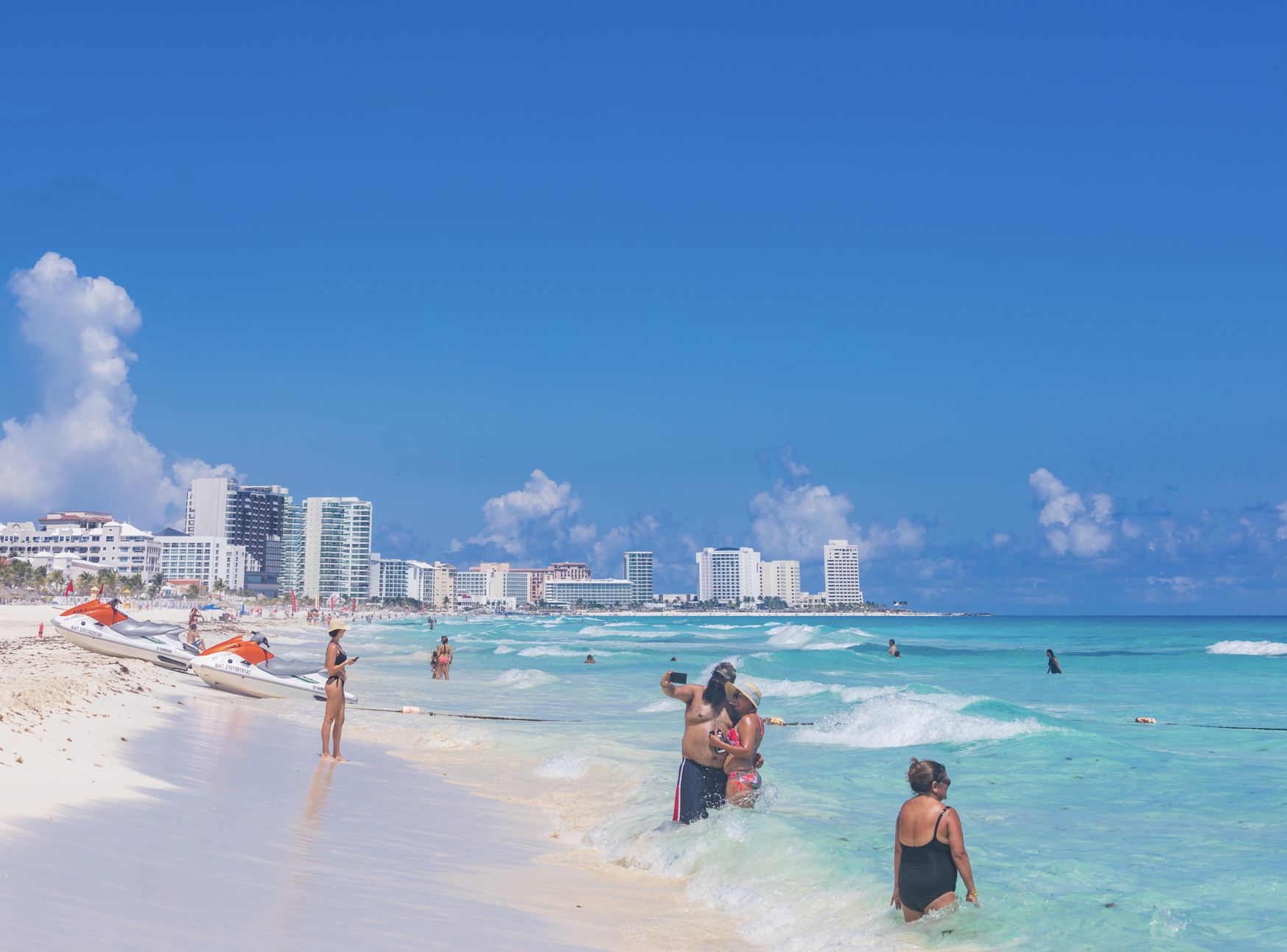 Cancun swimming beach with tourists