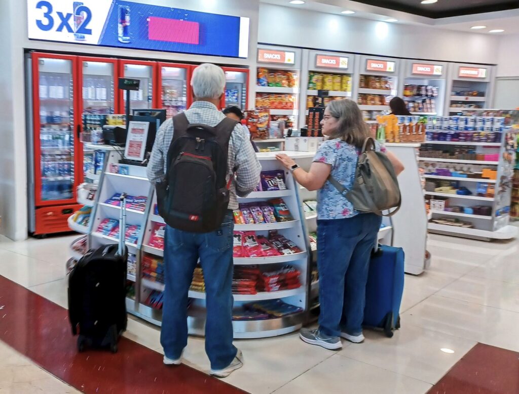 Travelers Buying snack at Cancun airport