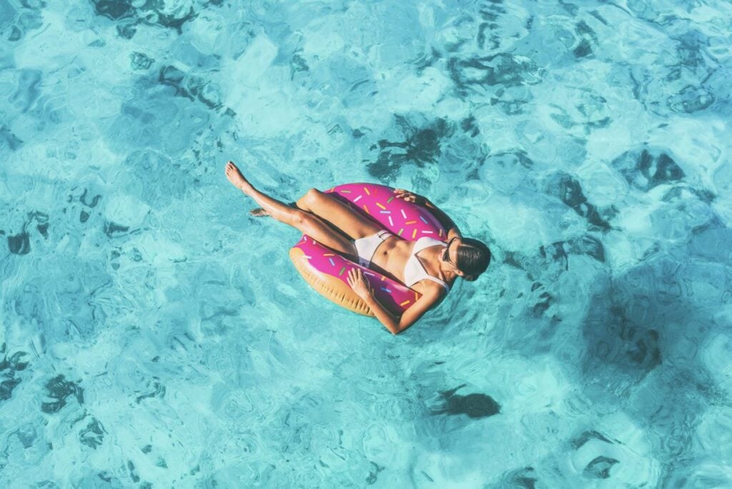Woman in pool floatie