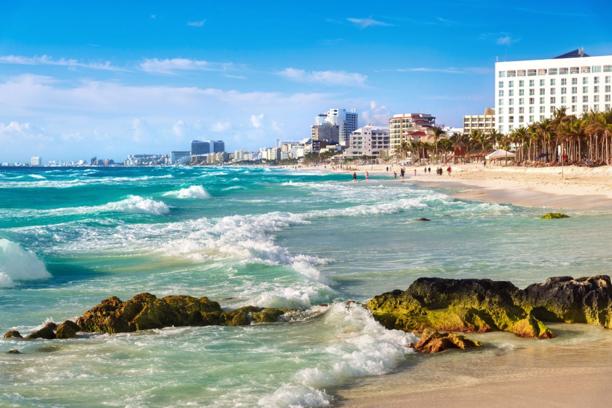 White sand beach on the blue Caribbean sea in Cancun city downtown, Mexico