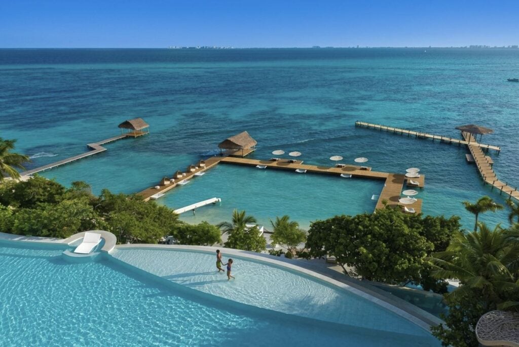 This Adults-Only Resort Near Cancun Has A Waterslide Into The Ocean & You Arrive On A Private Catamaran