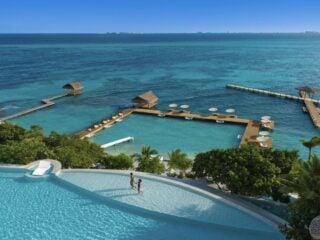 This Adults-Only Resort Near Cancun Has A Waterslide Into The Ocean & You Arrive On A Private Catamaran